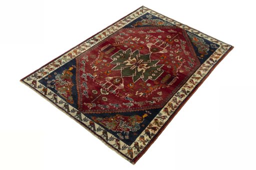 Corner detail of 2000s Shiraz rug showing border pattern and Wool pile
