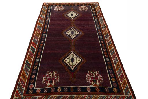 Surface texture of 1970s Shiraz rug with natural Wool and intricate pattern