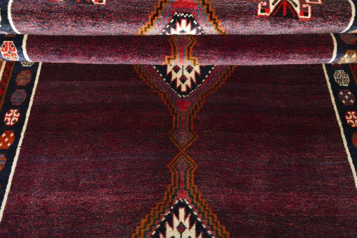 Full view of 1970s Shiraz rug from Iran / Persia, 285 × 151 cm in Red tones