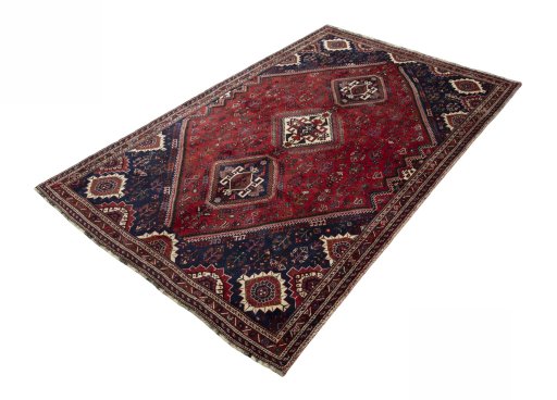 Corner detail of 2000s Shiraz rug showing border pattern and Wool pile