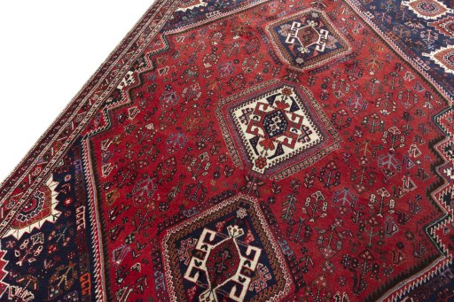 Backside of handmade 2000s Shiraz rug showing knot structure and weave density