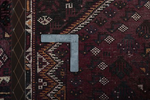 Surface texture of 2000s Shiraz rug with natural Wool and intricate pattern