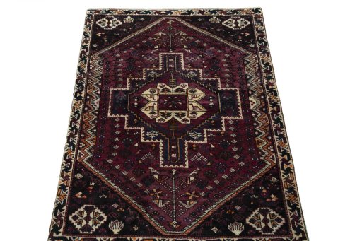 Surface texture of 2000s Shiraz rug with natural Wool and intricate pattern