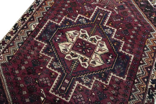 Backside of handmade 2000s Shiraz rug showing knot structure and weave density
