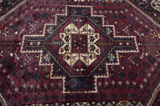 Central medallion detail of 2000s Shiraz rug from Iran / Persia
