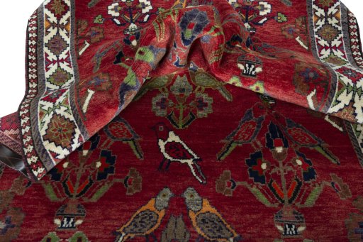 Corner detail of 2000s Shiraz rug showing border pattern and Wool pile