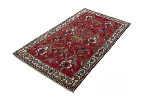 Corner detail of 2000s Shiraz rug showing border pattern and Wool pile