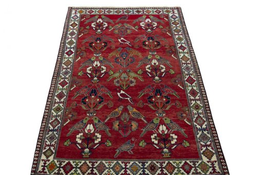 Surface texture of 2000s Shiraz rug with natural Wool and intricate pattern