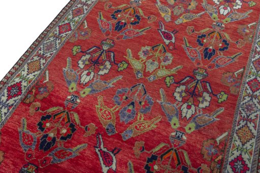 Backside of handmade 2000s Shiraz rug showing knot structure and weave density