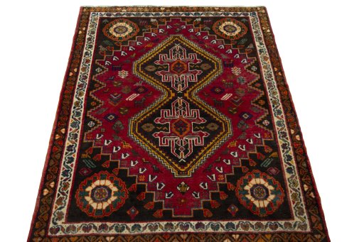 Surface texture of 2000s Shiraz rug with natural Wool and intricate pattern