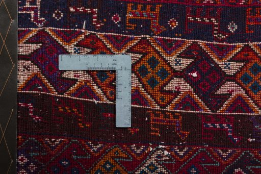 Backside of handmade 2000s Shiraz rug showing knot structure and weave density