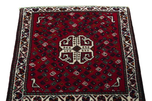 Surface texture of 2000s Shiraz rug with natural Wool and intricate pattern