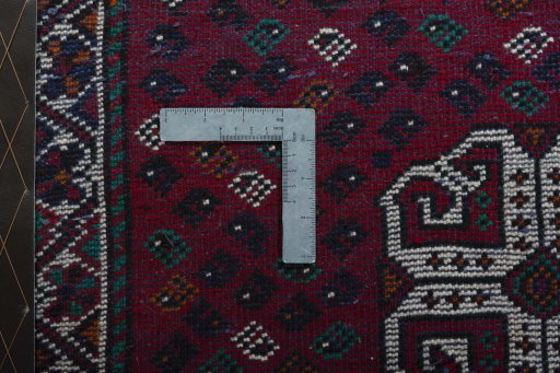 Backside of handmade 2000s Shiraz rug showing knot structure and weave density