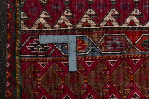 Backside of handmade 2000s Shiraz rug showing knot structure and weave density