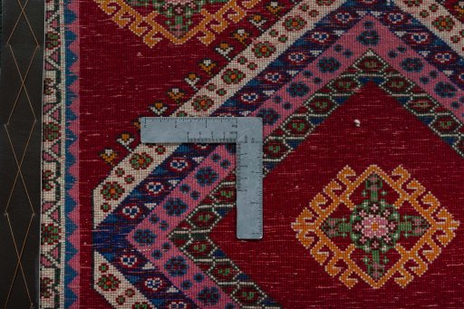 Backside of handmade 2000s Shiraz rug showing knot structure and weave density