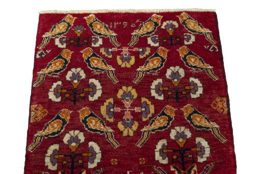 Surface texture of 2000s Shiraz rug with natural Wool and intricate pattern
