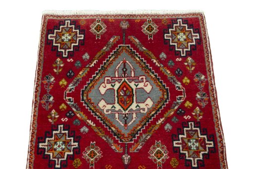 Surface texture of 2000s Shiraz rug with natural Wool and intricate pattern