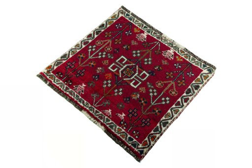 Corner detail of 2000s Shiraz rug showing border pattern and Wool pile