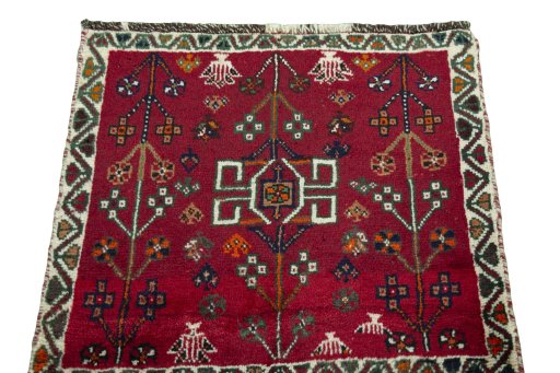 Surface texture of 2000s Shiraz rug with natural Wool and intricate pattern