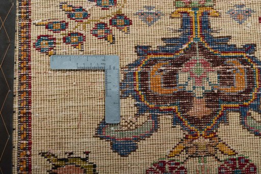 Backside of handmade 2000s Shiraz rug showing knot structure and weave density