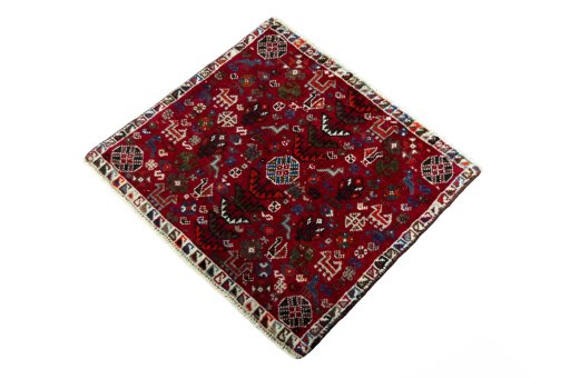 Corner detail of 2000s Shiraz rug showing border pattern and Wool pile