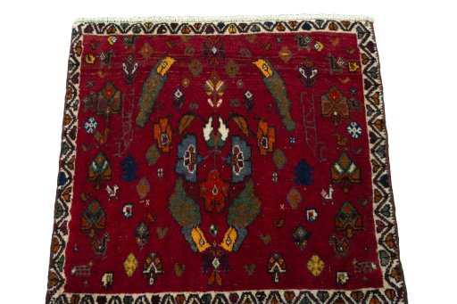 Surface texture of 2000s Shiraz rug with natural Wool and intricate pattern