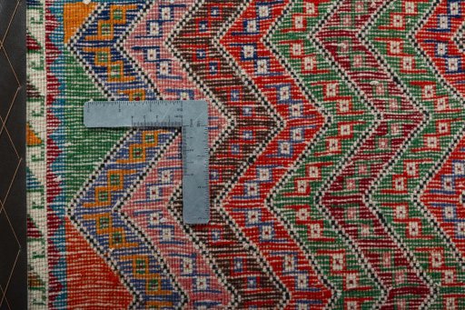 Backside of handmade 2000s Shiraz rug showing knot structure and weave density