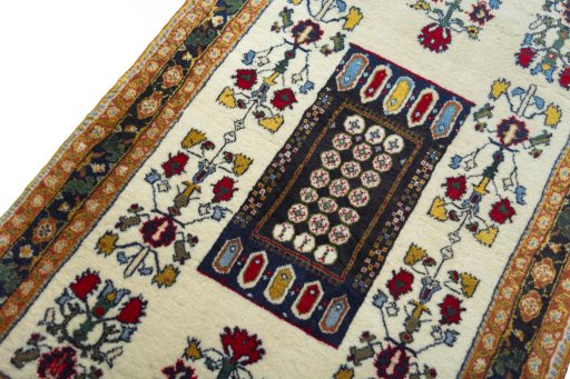 Backside of handmade 2000s Shiraz rug showing knot structure and weave density