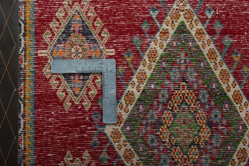 Backside of handmade 2000s Shiraz rug showing knot structure and weave density