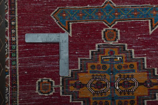 Backside of handmade 2000s Shiraz rug showing knot structure and weave density
