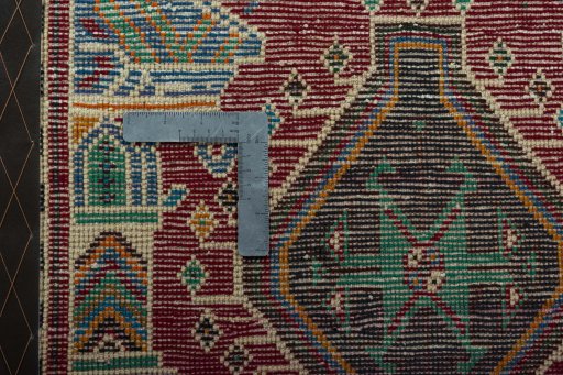 Backside of handmade 2000s Shiraz rug showing knot structure and weave density