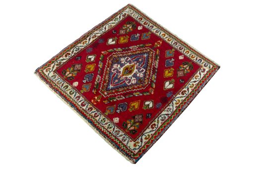Corner detail of 2000s Shiraz rug showing border pattern and Wool pile