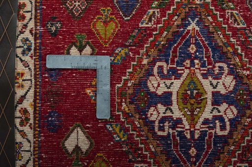 Backside of handmade 2000s Shiraz rug showing knot structure and weave density