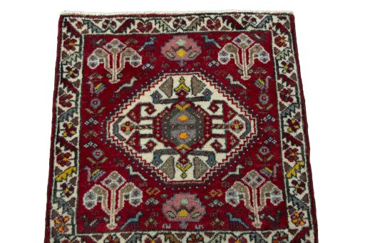 Surface texture of 2000s Shiraz rug with natural Wool and intricate pattern
