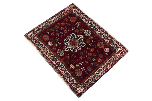 Corner detail of 2000s Shiraz rug showing border pattern and Wool pile