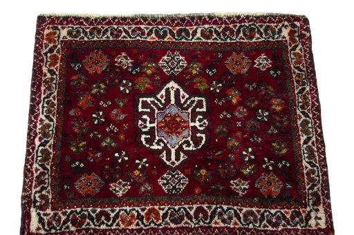 Surface texture of 2000s Shiraz rug with natural Wool and intricate pattern