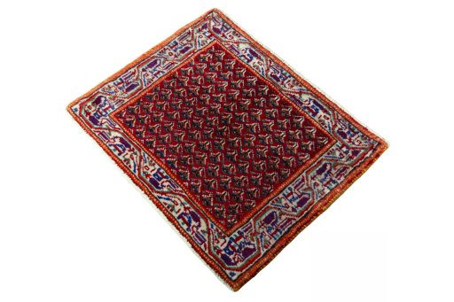Corner detail of 2000s Shiraz rug showing border pattern and Wool pile