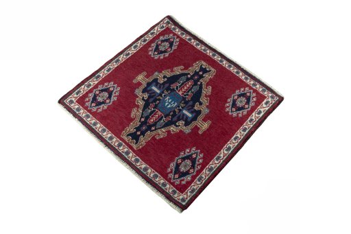 Corner detail of 2000s Shiraz rug showing border pattern and Wool pile