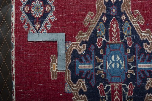 Backside of handmade 2000s Shiraz rug showing knot structure and weave density