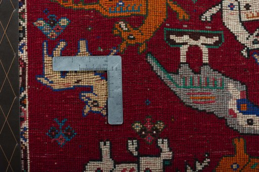 Backside of handmade 2000s Shiraz rug showing knot structure and weave density