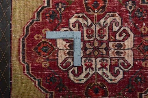 Backside of handmade 2000s Shiraz rug showing knot structure and weave density