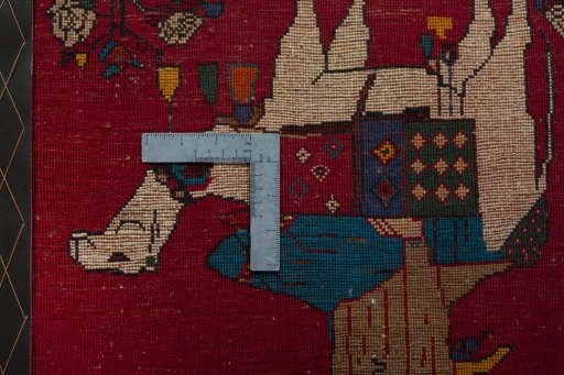 Backside of handmade 2000s Shiraz rug showing knot structure and weave density
