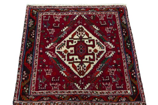 Surface texture of 2000s Shiraz rug with natural Wool and intricate pattern
