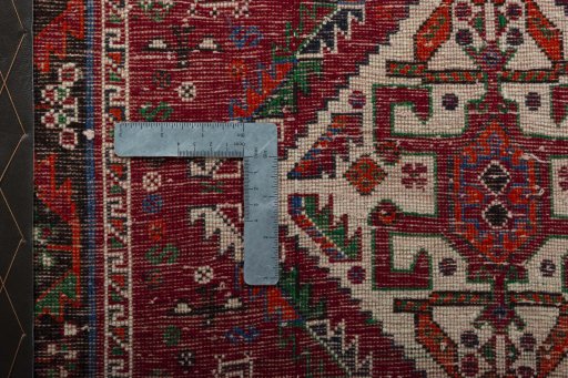 Backside of handmade 2000s Shiraz rug showing knot structure and weave density