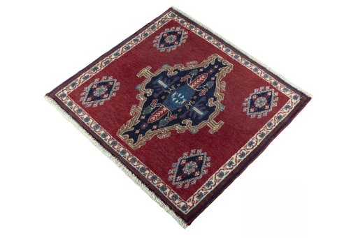 Corner detail of 2000s Shiraz rug showing border pattern and Wool pile
