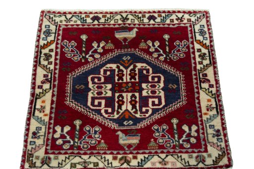 Surface texture of 2000s Shiraz rug with natural Wool and intricate pattern