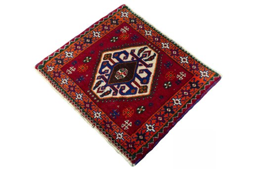 Corner detail of 2000s Shiraz rug showing border pattern and Wool pile