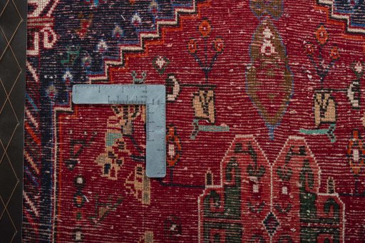 Backside of handmade 2000s Shiraz rug showing knot structure and weave density
