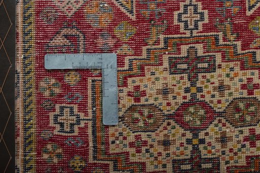 Backside of handmade 2000s Shiraz rug showing knot structure and weave density