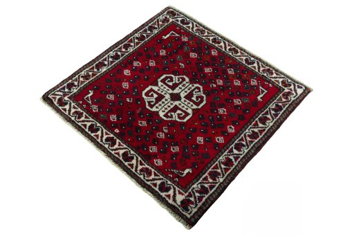 Corner detail of 2000s Shiraz rug showing border pattern and Wool pile